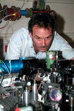 Professor Chris Phillips, pictured here in the Laser Laboratory of Imperial College, and fellow researchers, have developed an optical effect that they believe could render solid objects transparent